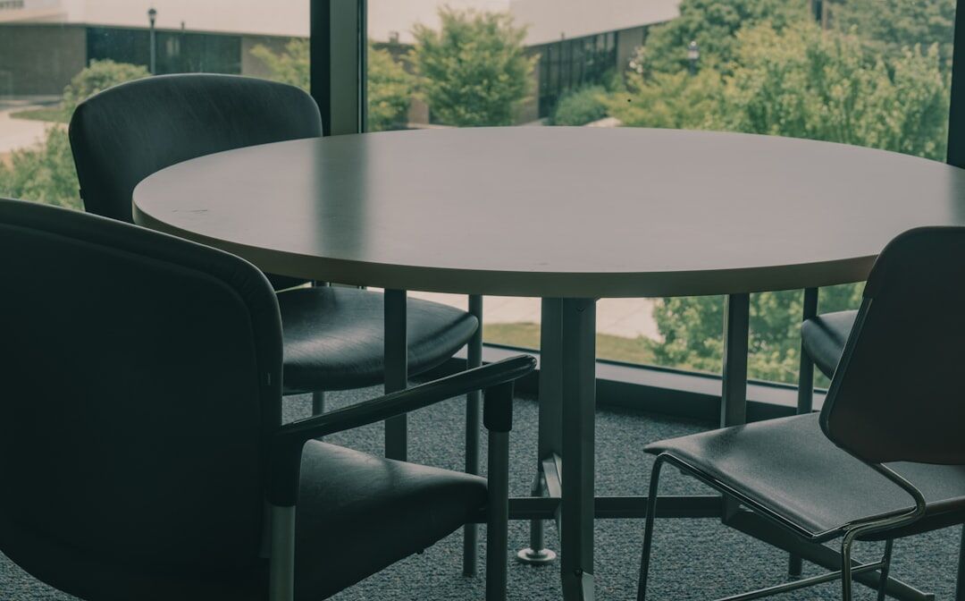 Corporate business summit with executives seated at round table